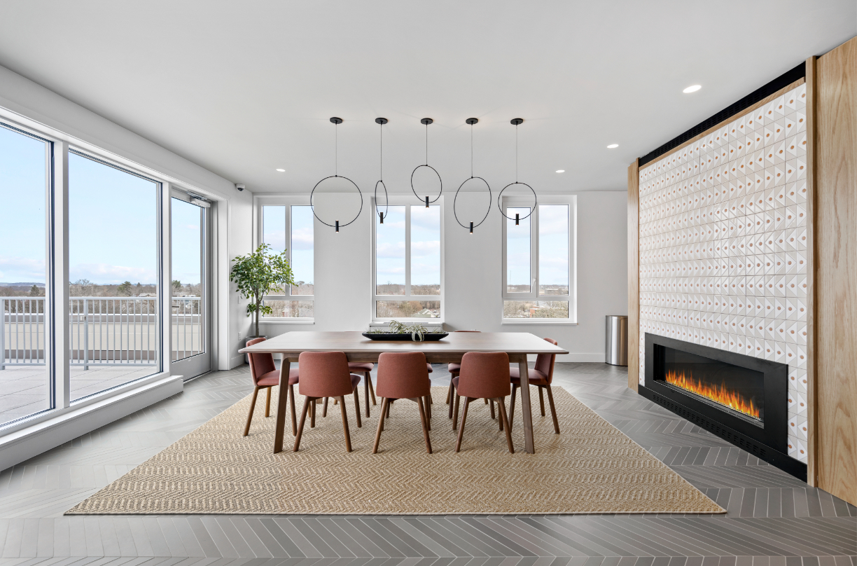 Rooftop fireplace lounge with ambient lighting.